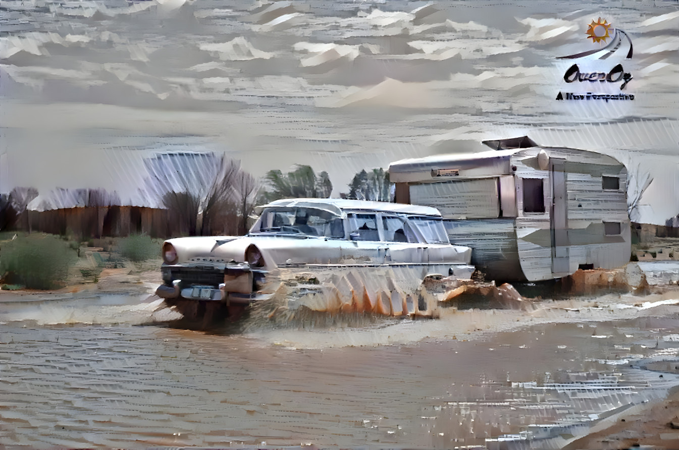 EK Holden wagon crossing water with caravan