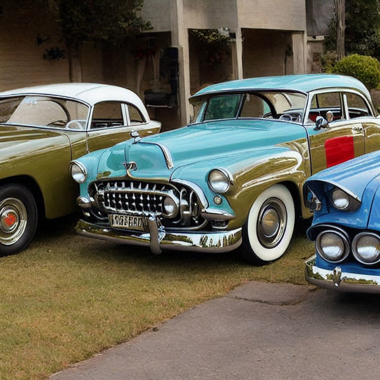 Three Classic Vintage Cars with Chrome Bumpers