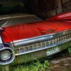 Digitally altered surreal red Cadillac with exaggerated features