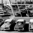 Vintage Car Parking Lot Illustration with Classic Cars and People