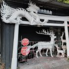 White Sculptural Dragon with Multiple Heads and Fierce Expressions in Pavilion Setting