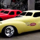 Custom yellow classic car and red sports car in garage with automotive equipment