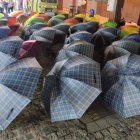 Colorful Umbrellas in Rainy City Street