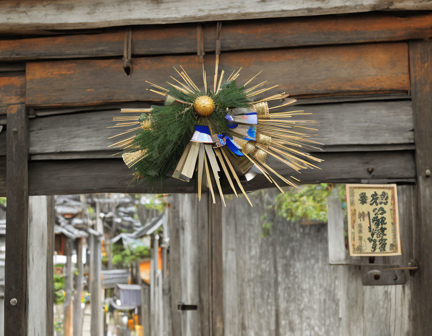 Traditional Japanese New Year Shimekazari on Wooden Gate with Blurred Alleyway