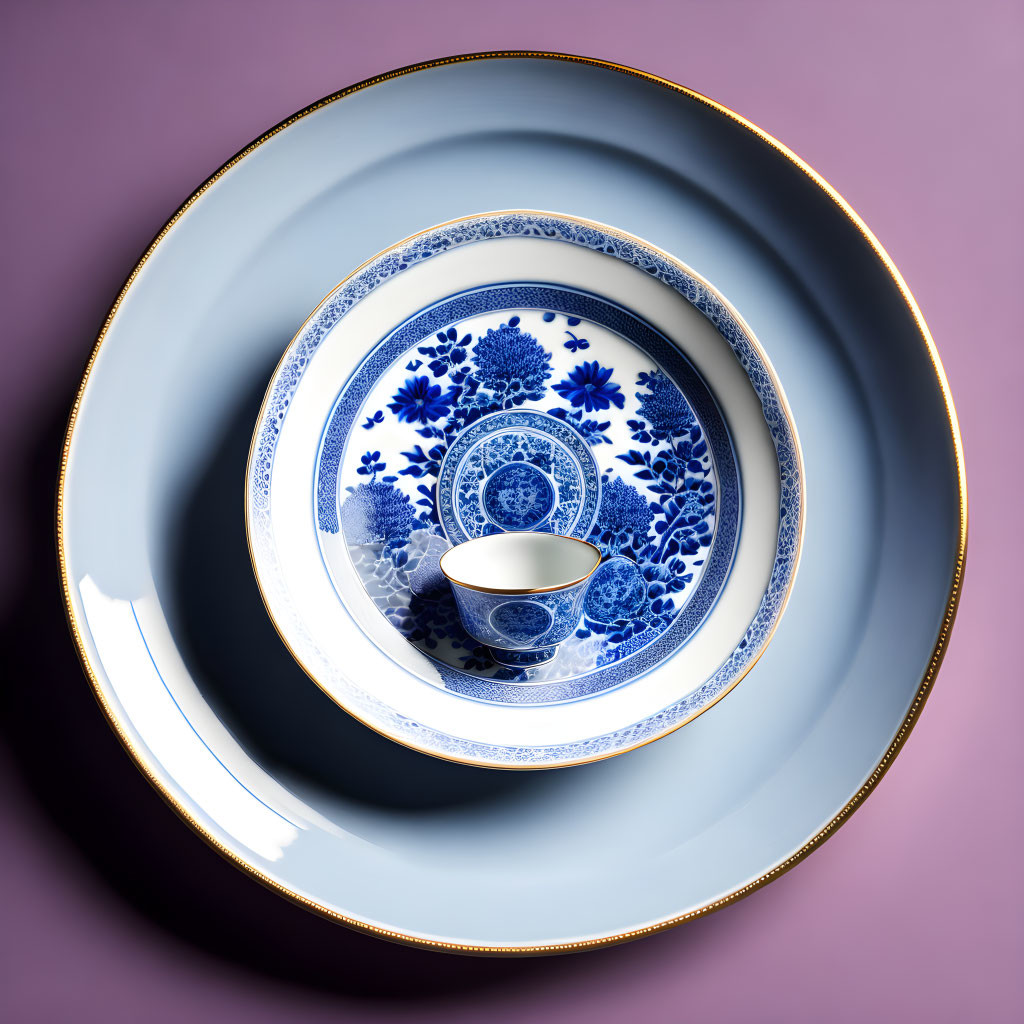 Blue and White Porcelain Dishes with Floral Pattern on Pink Background