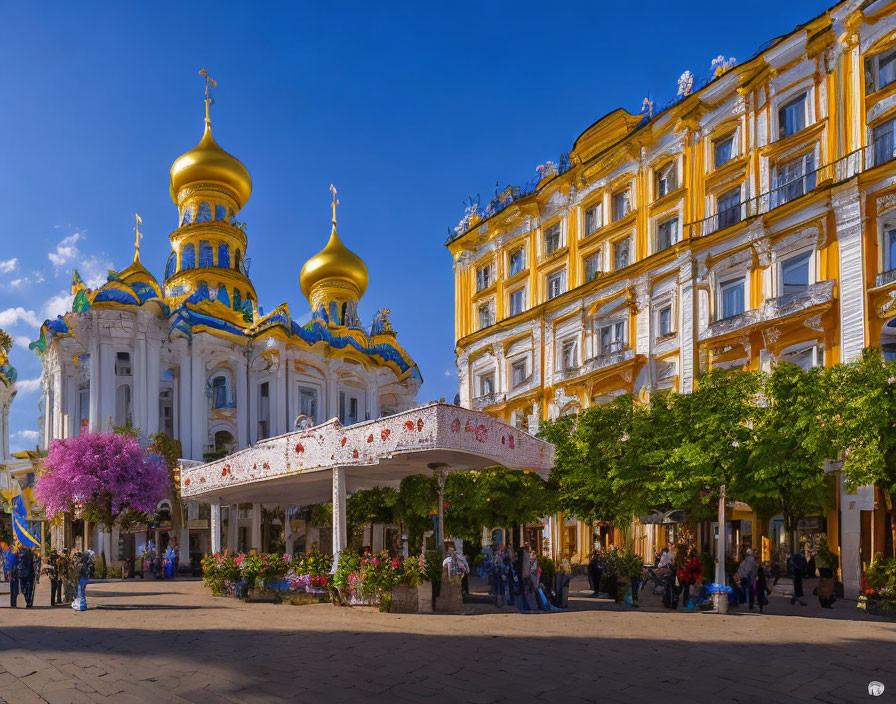 Golden-domed building and classic architecture with blooming trees and people under blue skies