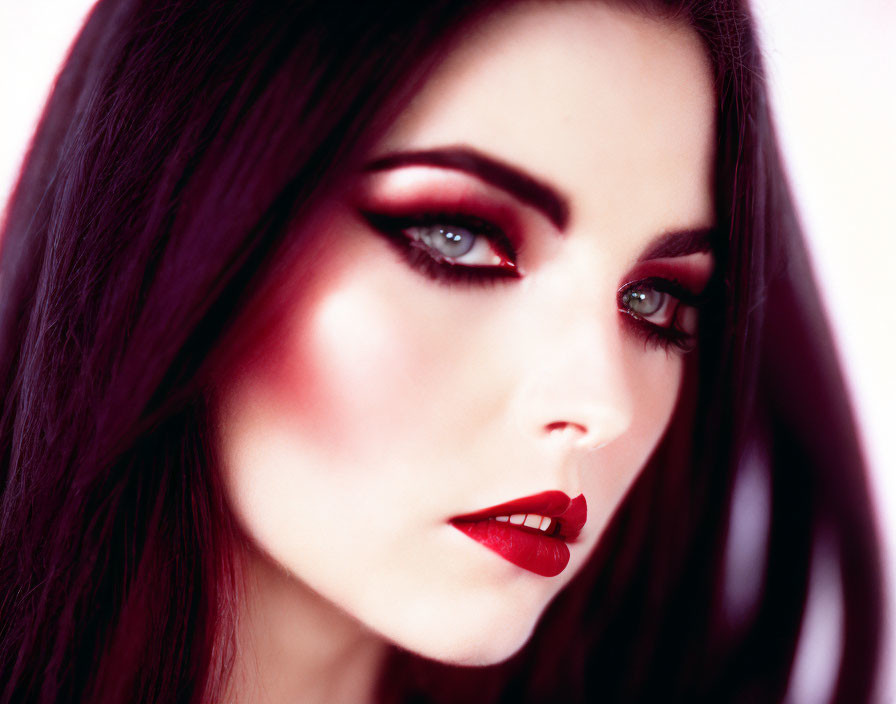 Detailed Close-Up of Person with Dark Red Lipstick and Smoky Eyeshadow