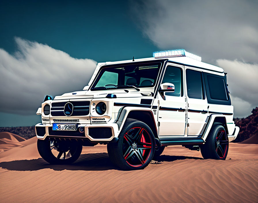 White Mercedes-Benz G-Class SUV with Custom Red-Rimmed Wheels on Sandy Terrain