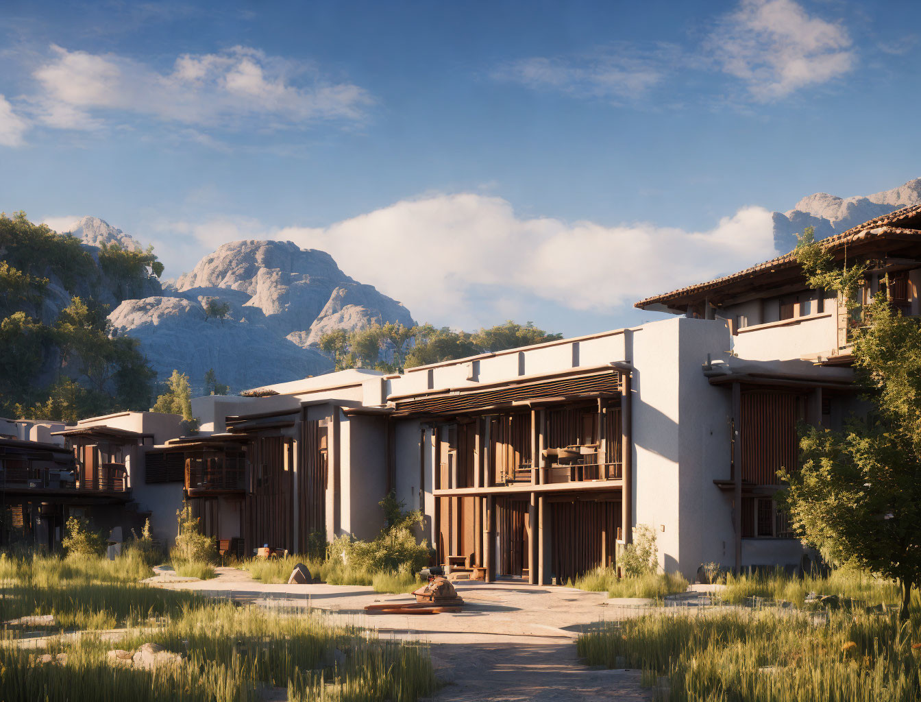 Rustic wooden buildings in tall grass with mountain backdrop