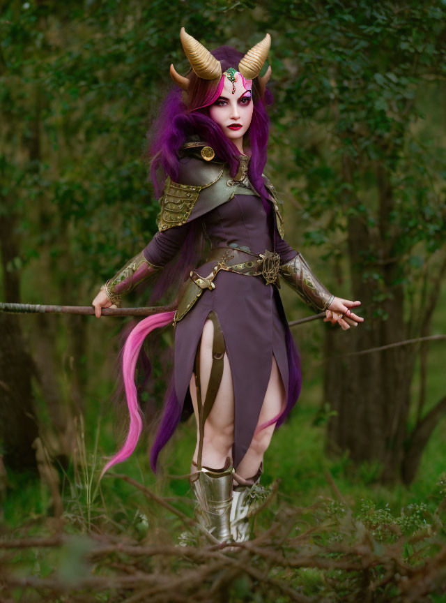 Fantasy armor costume with purple hair and horns in forest pose with spear