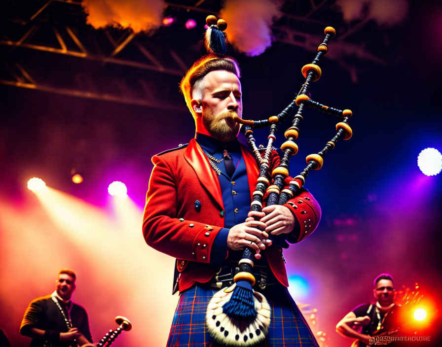 Bearded Bagpiper Performs in Vibrant Red Uniform on Stage