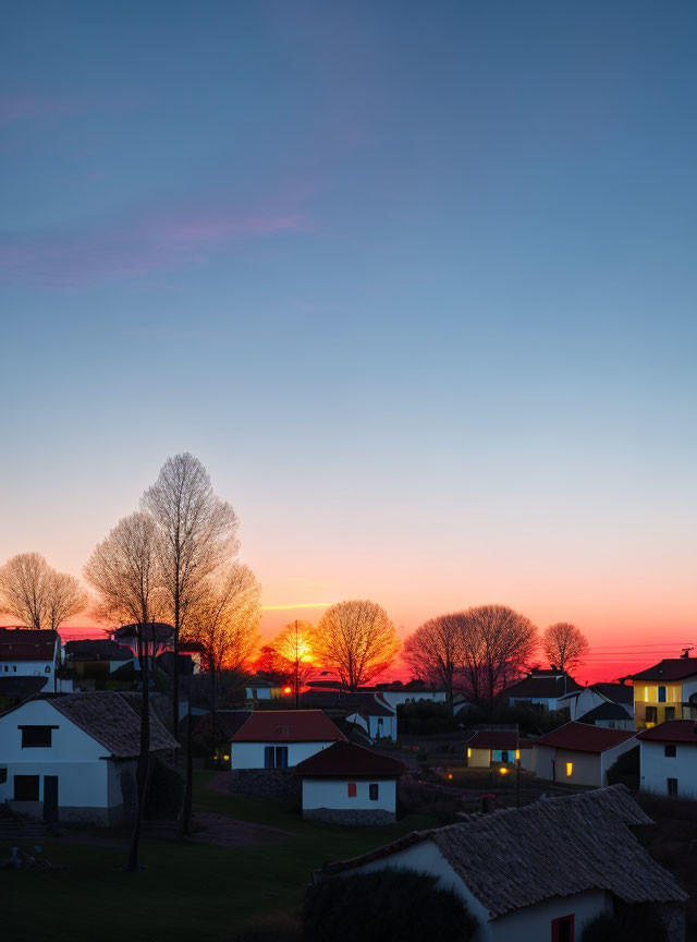A sunset over a small village.