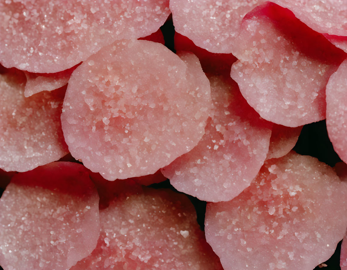Pink sugar-coated gummy candies in close-up view