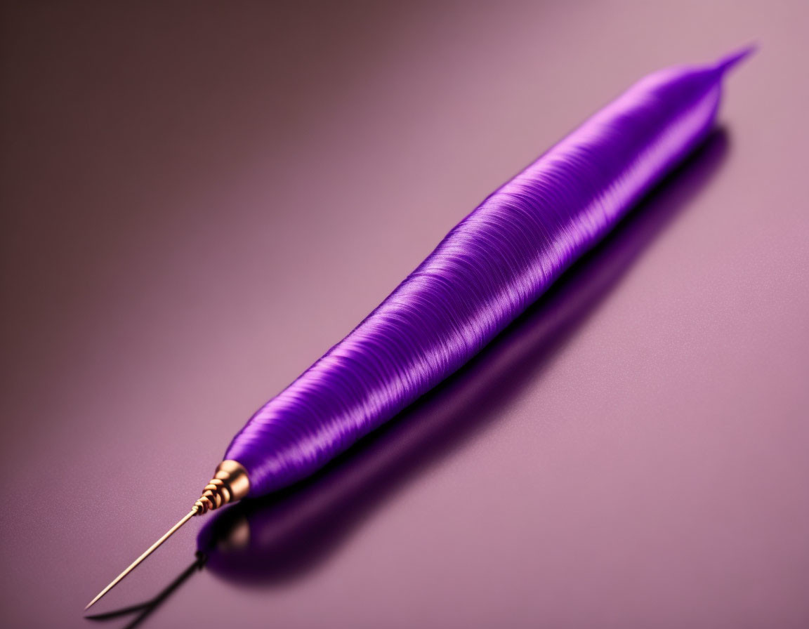 Metallic Purple Fountain Pen with Gold Nib on Purple Background