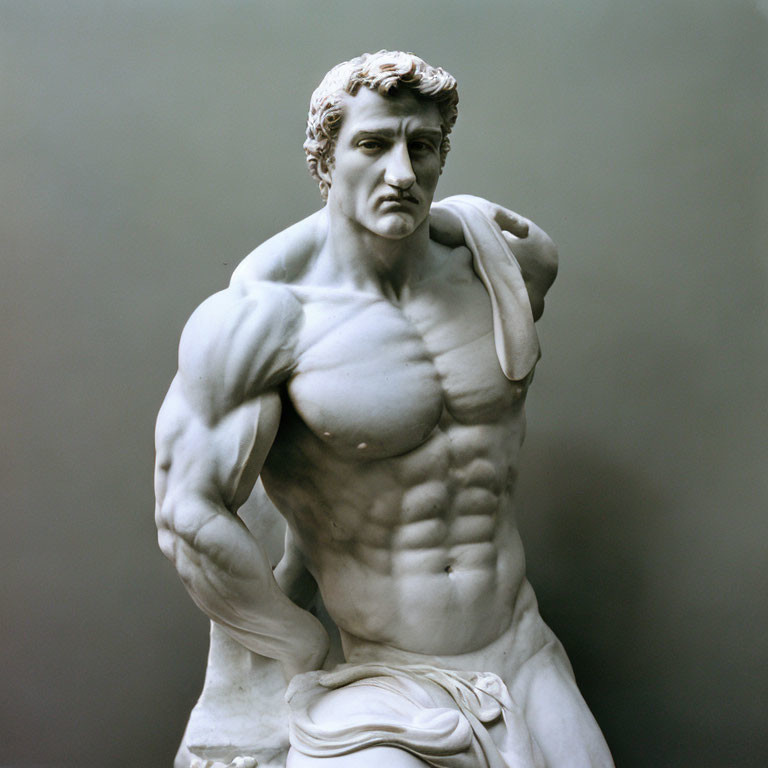 Muscular male statue with defined abs and drapery, contemplative expression