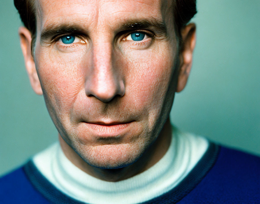 Portrait of Man with Striking Blue Eyes and Dark Hair