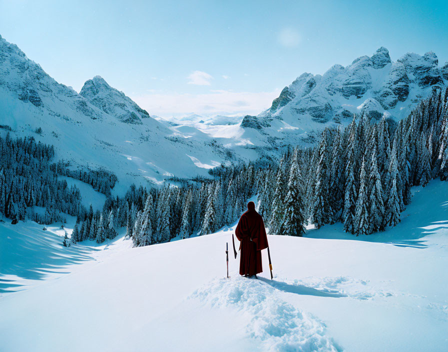 robed figure walking through snow
