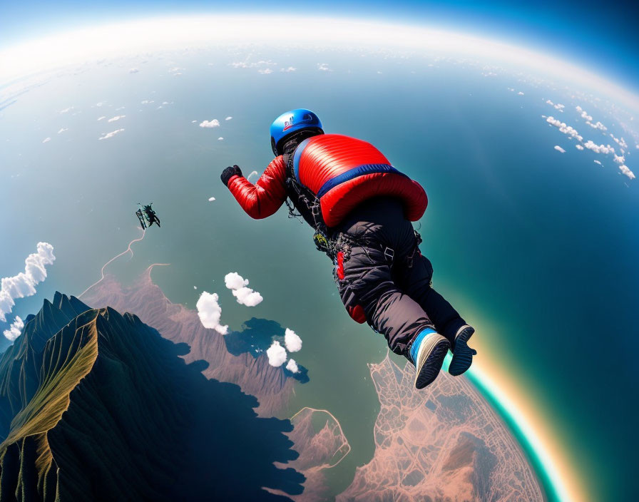 Skydivers in red and blue suits freefalling with curved horizon and clouds.