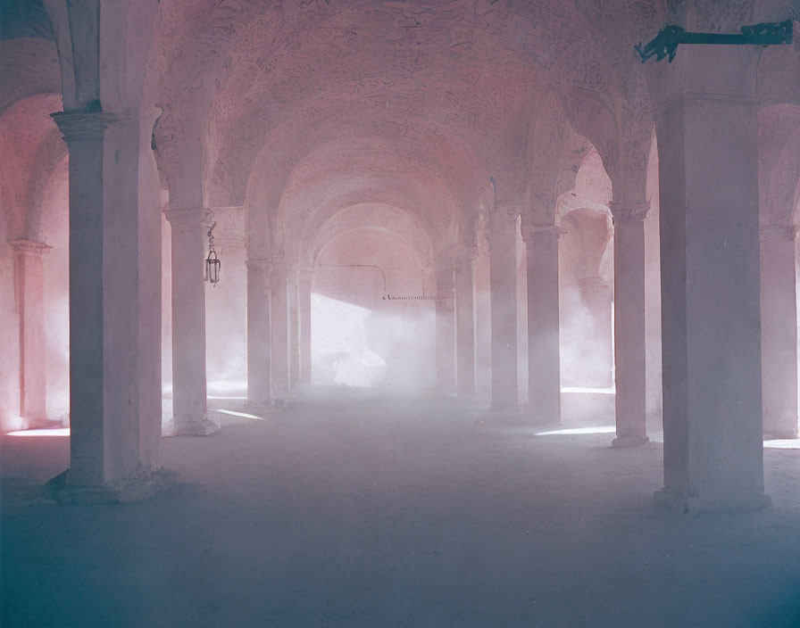 Ornate building interior with misty pink and blue hues