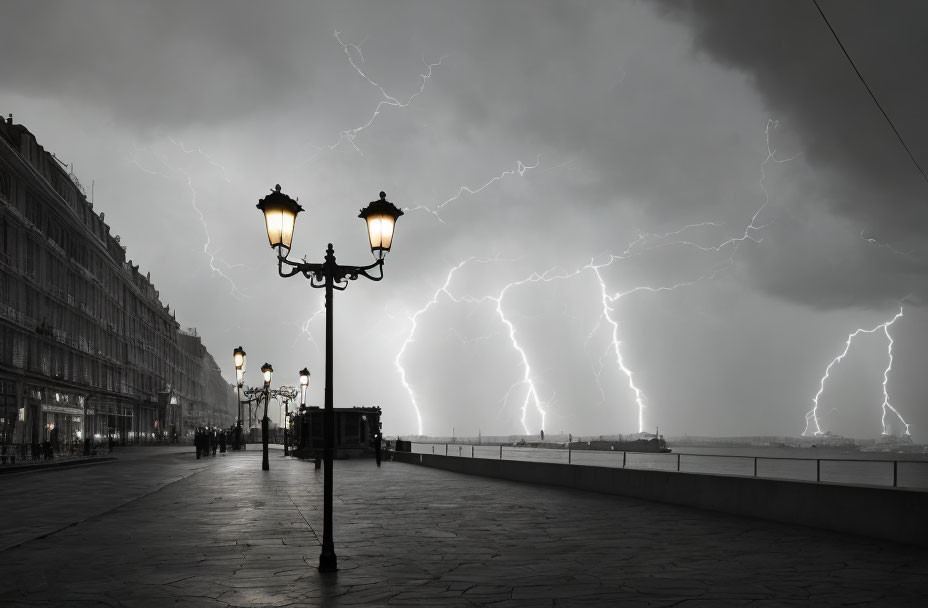 Monochrome cityscape with streetlight and lightning bolts under stormy sky