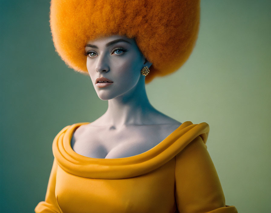 Woman with Large Orange Afro in Mustard Top on Teal Background