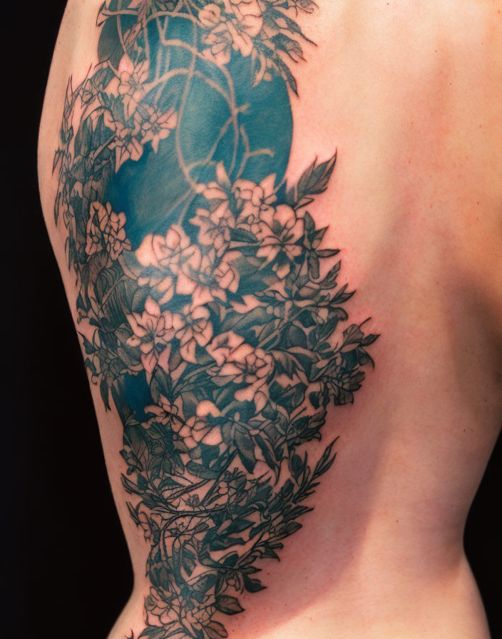 Tattoo on the back with flowers