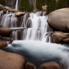 Tranquil forest waterfall with silky water flow