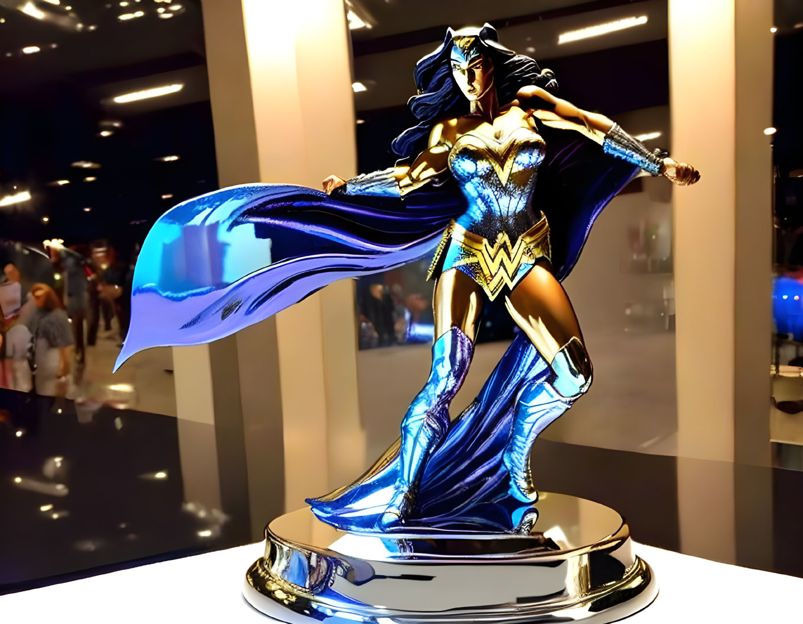 Shiny Wonder Woman Figurine with Flowing Cape Displayed at Convention