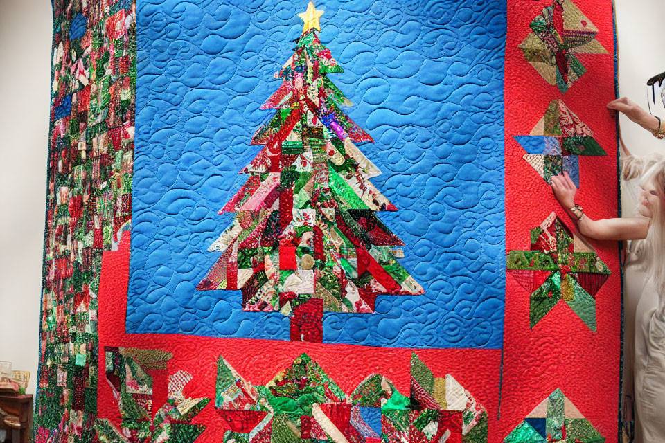 Vibrant Christmas tree patchwork quilt on red and blue background