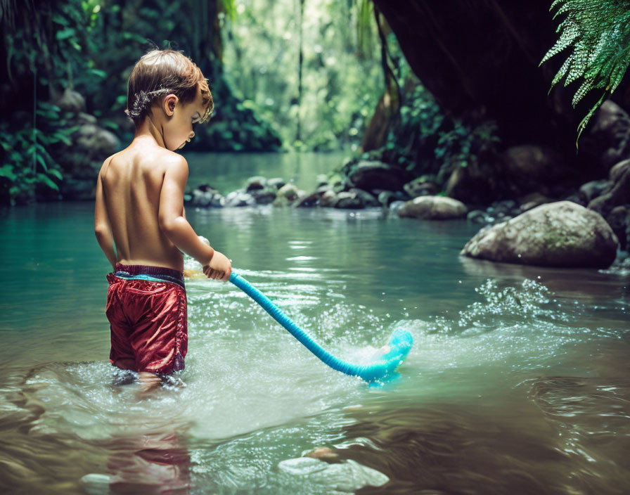 Boy playing in the river