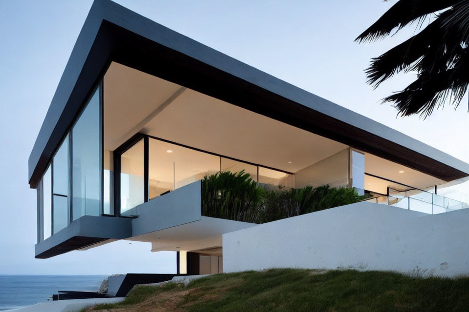 Contemporary cantilevered house with glass walls and sea-view balconies