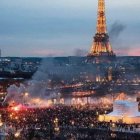 Paris Twilight Scene: Eiffel Tower Illuminated with Bonfire in Foreground