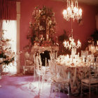 Opulent pink dining room with chandelier and elegantly dressed guests