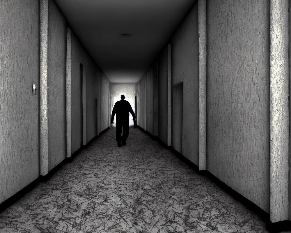 Silhouette of a person in dimly lit corridor with textured walls