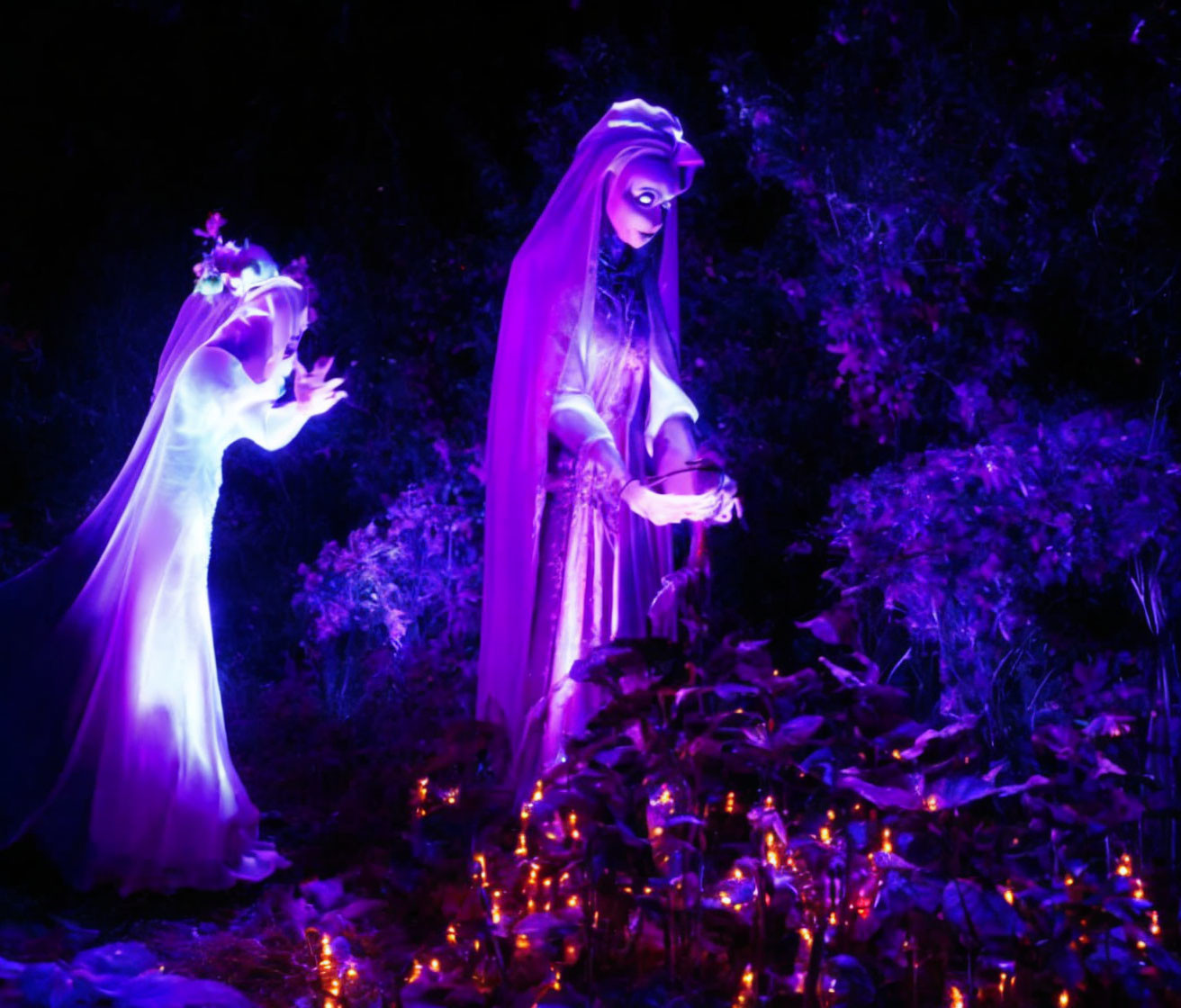 Ghostly wraiths haunt a midnight garden on Hallowe