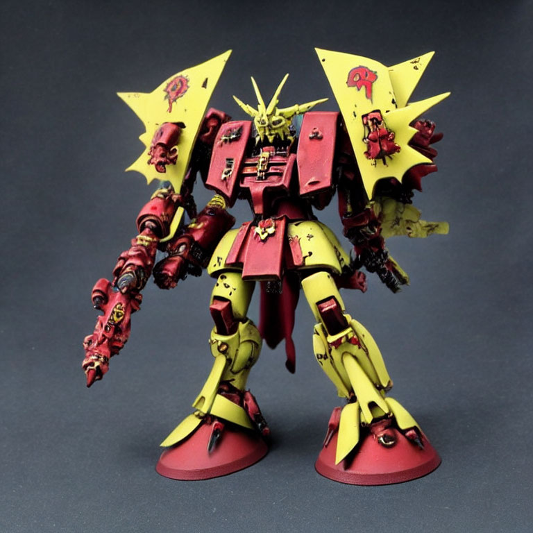 Detailed Red and Yellow Mecha Model with Shoulder Panels, Markings, and Horned Helmet