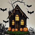 Haunted house, glowing pumpkins, flying bats in spooky Halloween scene