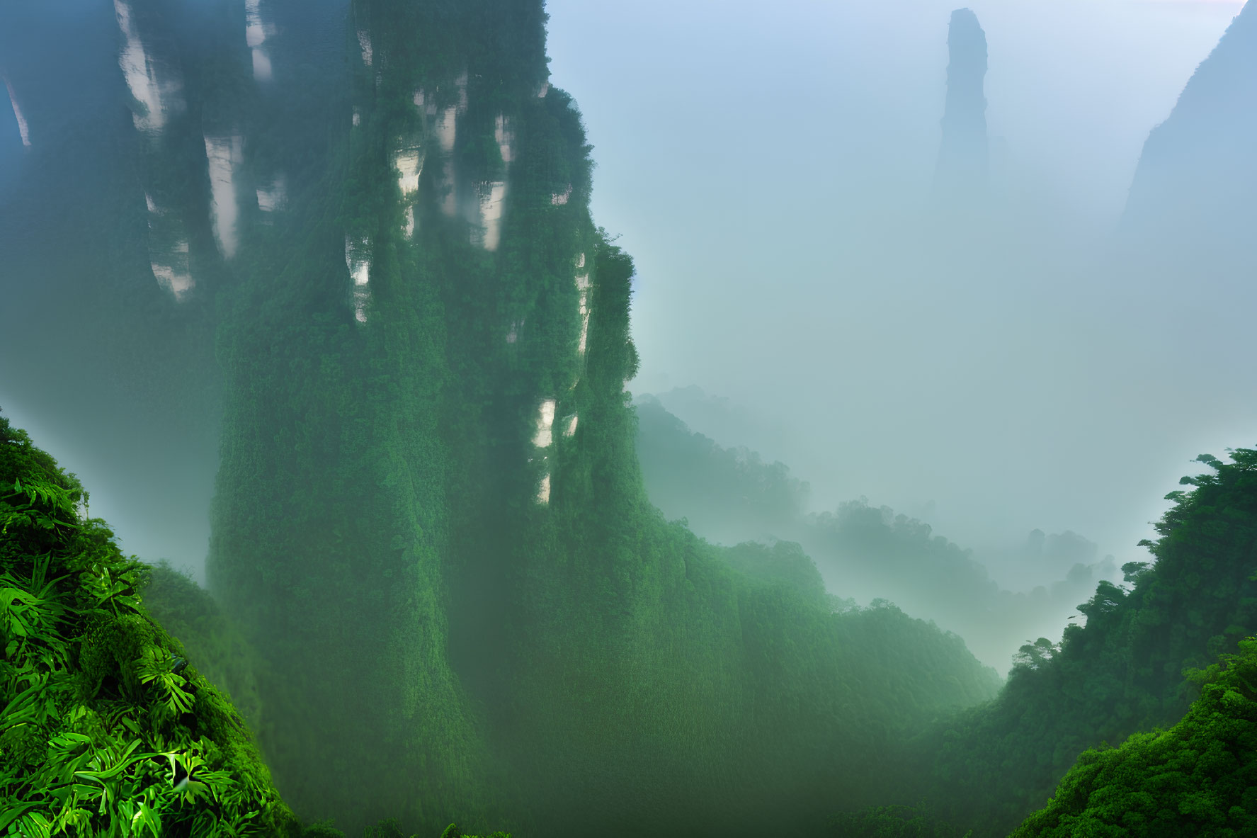 Misty green mountains with dense foliage and hazy sky