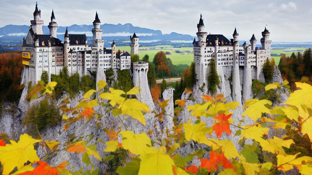 Fairytale castle with white towers on rugged cliff amid autumn trees