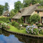 Tranquil river and thatched-roof cottages in lush garden landscape