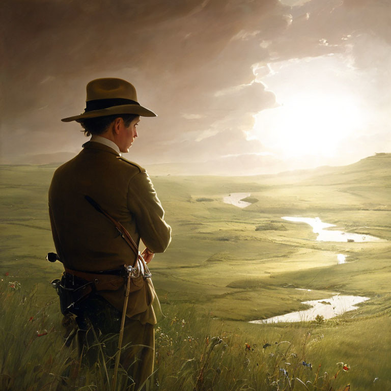 Person in hat and coat in lush field at sunset with winding river and dramatic sky