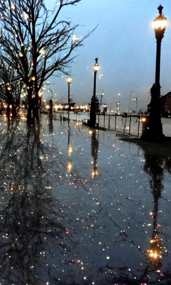 Dusk scene of rain-soaked promenade with glistening pavement