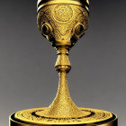Detailed Golden Trophy with Intricate Patterns and Wide Cup on Decorated Stem