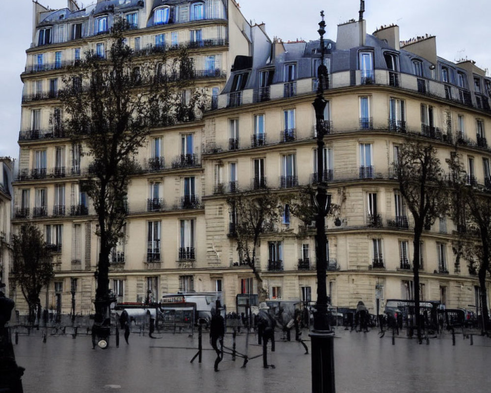 Parisian Haussmann-style buildings and street scene with people on wet pavement