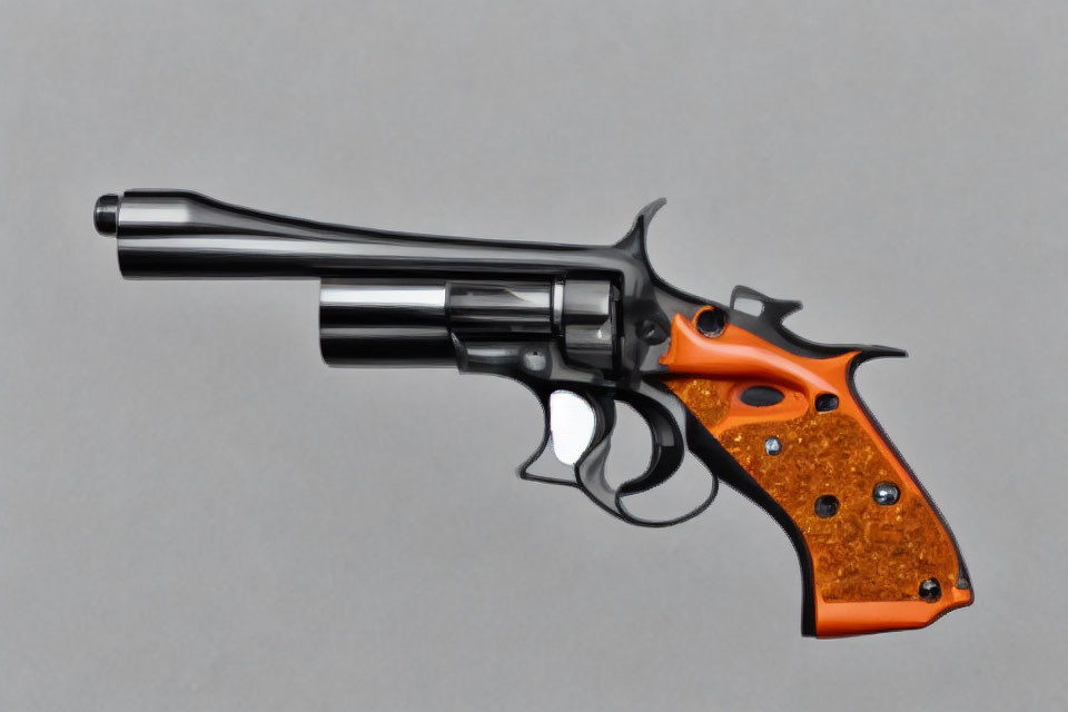 Shiny black revolver with orange-brown grip on gray background