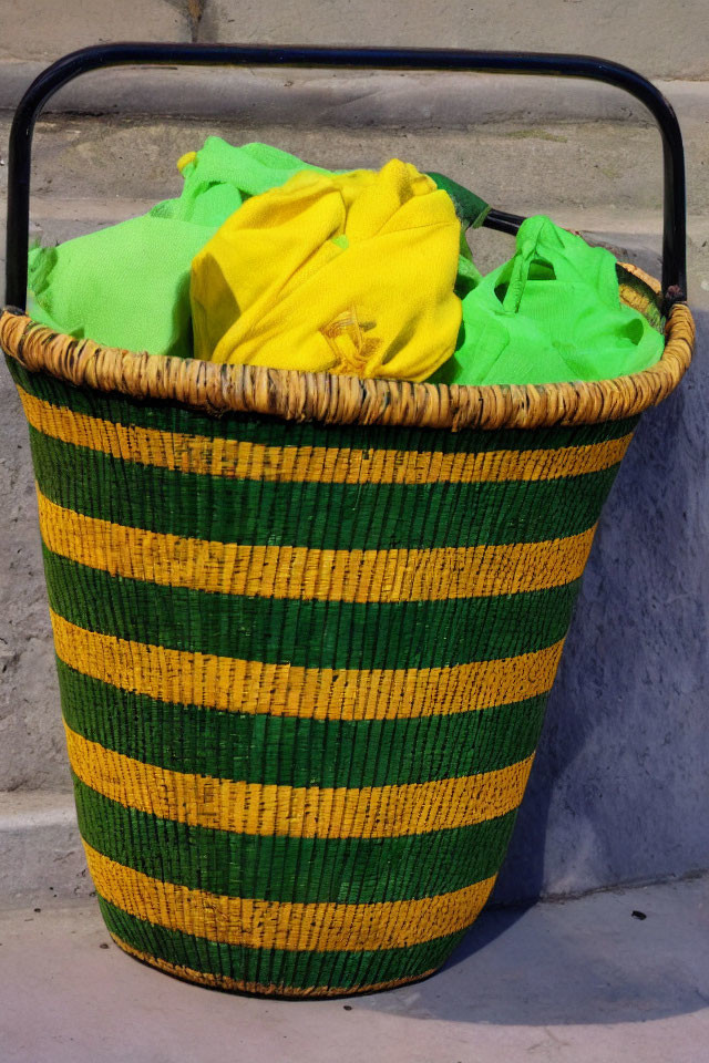 Green and Yellow Striped Woven Basket with Fabrics