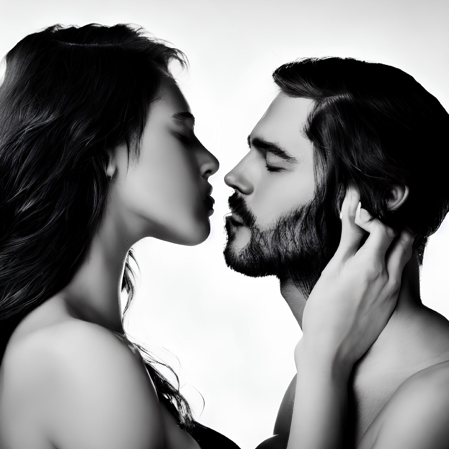 Man and woman in profile about to kiss on white background