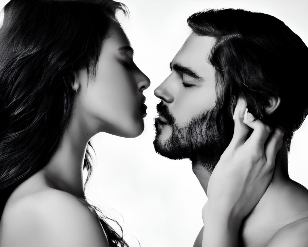 Man and woman in profile about to kiss on white background