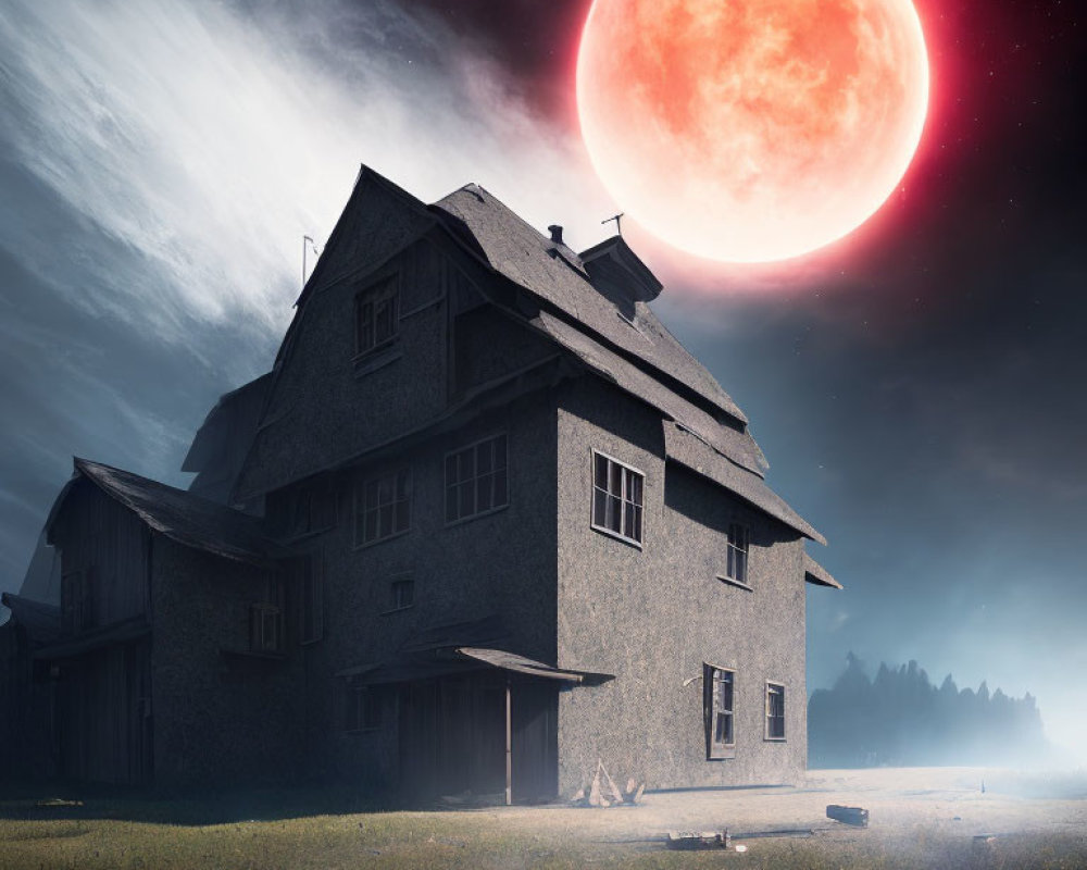 Spooky old house under red moon in misty landscape