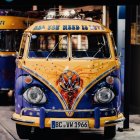 Colorful Volkswagen bus with psychedelic paint job in autumn setting
